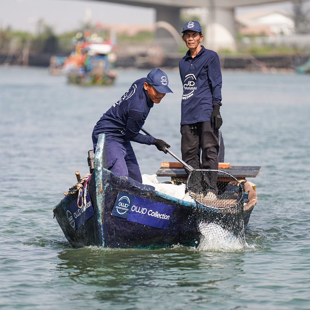 OWP Collection boat with two collectors on the water