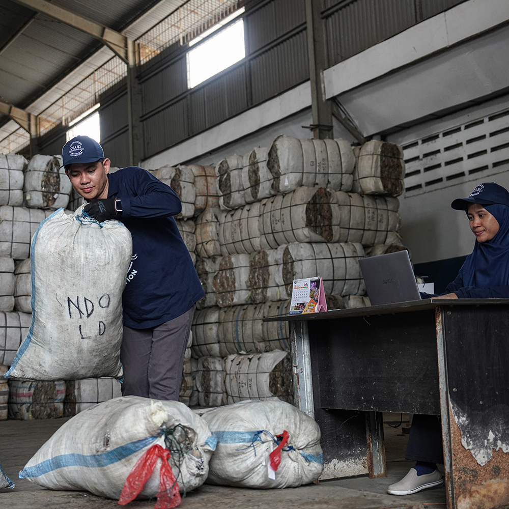 Bags of collected plastic being registered at the sorting station